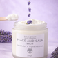Jar of 'Peace and Calm' balm with lavender flowers on a purple background